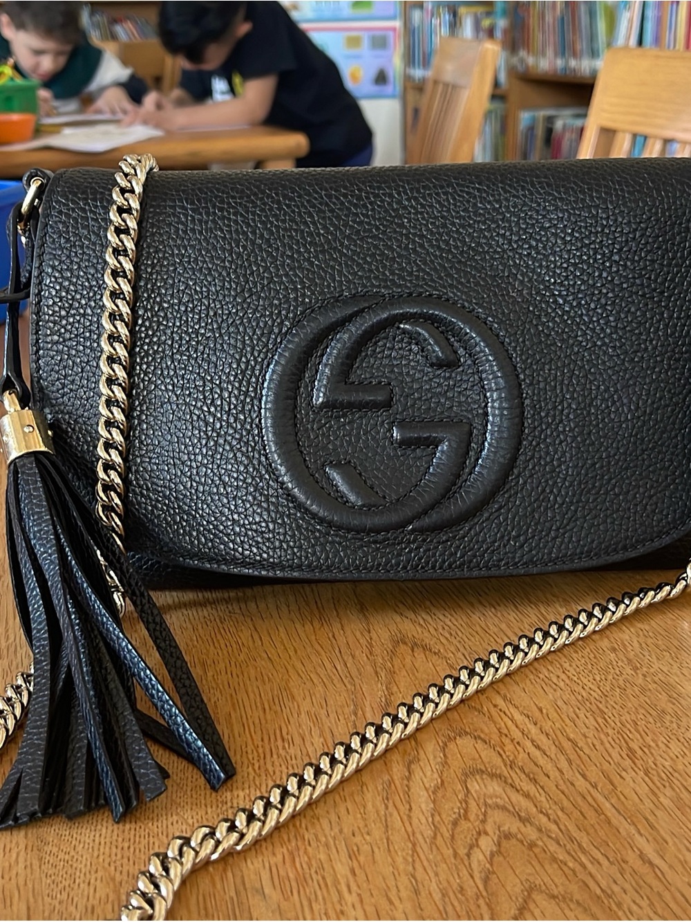 Gucci Black Pebbled Leather Crossbody with Gold Chain and Tassel
